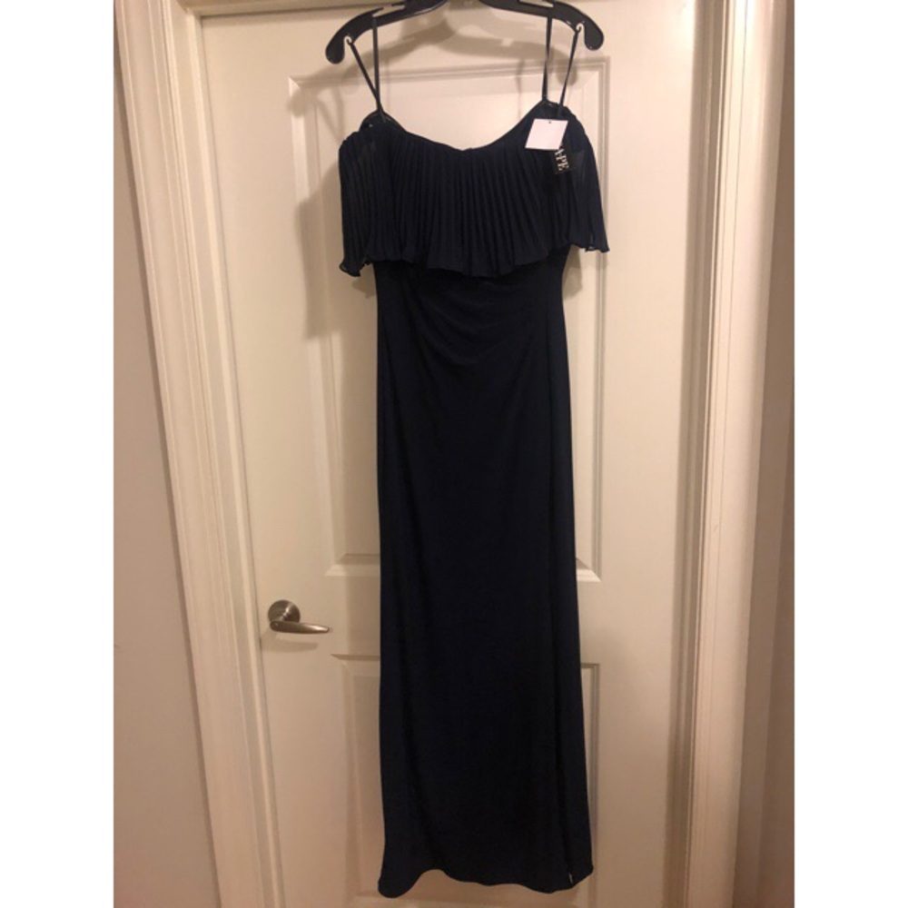 Never worn- Navy blue ruffle gown